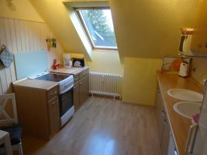 Kuchyň nebo kuchyňský kout v ubytování Ferienwohnung Hamburg - Stapelfeld