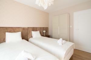 Posteľ alebo postele v izbe v ubytovaní Aparthotel Weissa 7