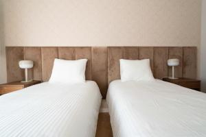 Posteľ alebo postele v izbe v ubytovaní Aparthotel Weissa 7