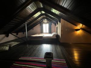 a large room with two beds and a window at Best Holiday Apartment in Bhurban