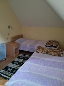 Postel nebo postele na pokoji v ubytování Vikendica Obradović + 37 fotografií
