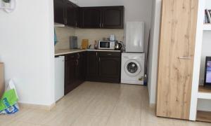 a kitchen with a refrigerator and a washing machine at Etara 2 Apartment in Sveti Vlas