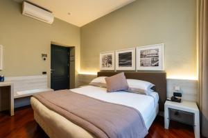 Postel nebo postele na pokoji v ubytování Hotel Centrale