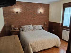 A bed or beds in a room at VuT Casa Fabe12