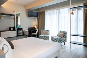 Postel nebo postele na pokoji v ubytování Vision Hotel