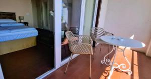 Postel nebo postele na pokoji v ubytování La Kascina Suite & Rooms