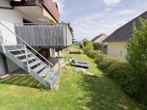 a staircase leading up to a house at Moderne Luxus-Oase in Gailingen mit Garten, 2 Balkone, Nähe Bodensee & Rheinfall in Gailingen