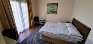 Postel nebo postele na pokoji v ubytování La Kascina Suite & Rooms