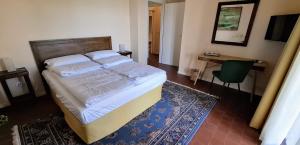 Postel nebo postele na pokoji v ubytování La Kascina Suite & Rooms