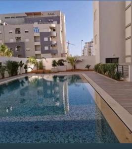 a swimming pool in the middle of a building at Lynda in Nabeul