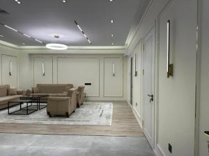 a living room with couches and chairs and a table at Dushanbe Place Apartments 2 in Dushanbe