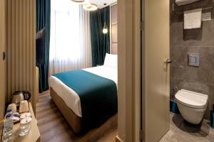 a hotel room with a bed and a toilet at THE NEST HOTEL in Istanbul +71 photos