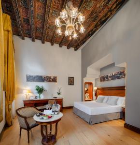 Postel nebo postele na pokoji v ubytování All’Angelo Art Hotel
