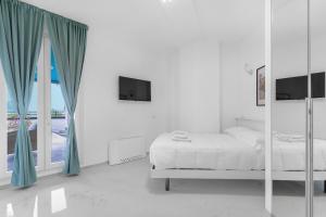 Кровать или кровати в номере Ponale Suites Foresteria Lombarda