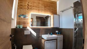 a bathroom with a sink and a mirror at Apartment in Reutte, Austria in Pflach