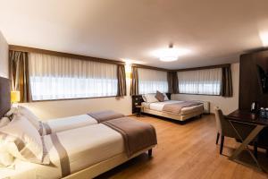 Кровать или кровати в номере Hotel Como