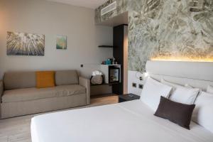 Postel nebo postele na pokoji v ubytování Vision Hotel