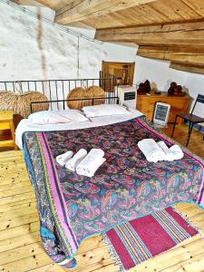 A bed or beds in a room at Case Rurali Pentedattilo