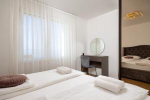 Posteľ alebo postele v izbe v ubytovaní Seaside Luxury Apartment Tanita