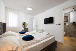 Posteľ alebo postele v izbe v ubytovaní Seaside Luxury Apartment Tanita