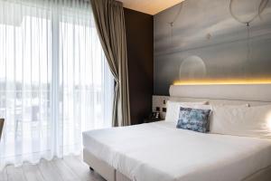 Postel nebo postele na pokoji v ubytování Vision Hotel