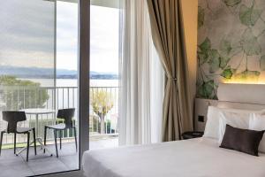 Postel nebo postele na pokoji v ubytování Vision Hotel