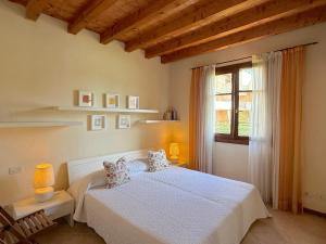 Postel nebo postele na pokoji v ubytování Garda Resort Village + 113 fotografií