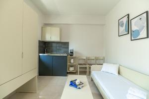 Posteľ alebo postele v izbe v ubytovaní Rhoe Seaside Apartments