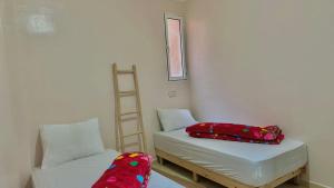 Ένα ή περισσότερα κρεβάτια σε δωμάτιο στο HOTEL 7DAYS DAkHLA