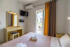 Posteľ alebo postele v izbe v ubytovaní Rhoe Seaside Apartments