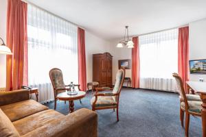 TV a/nebo společenská místnost v ubytování Hotel Stranddistel Rügen