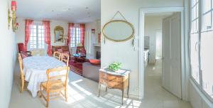 a bedroom with a bed and a mirror in a room at Maison Studios & Appartements Les 4 Vents in Luc-sur-Mer