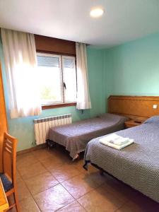 Postel nebo postele na pokoji v ubytování HOSTAL DON JAVIER