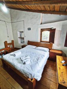 A bed or beds in a room at Case Rurali Pentedattilo
