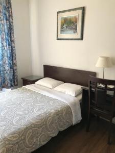 Postel nebo postele na pokoji v ubytování Hotel Bon Accueil