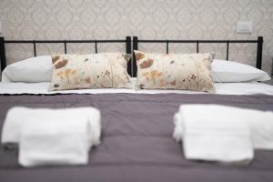 Postel nebo postele na pokoji v ubytování Residenze Miao