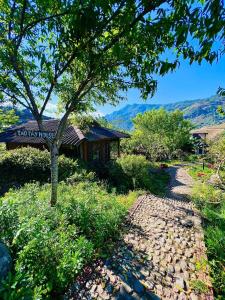 a sign that reads koshk lodge next to a path at Tao Tay House - Ta Van in Sapa