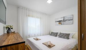 Ένα ή περισσότερα κρεβάτια σε δωμάτιο στο Apartment Eden