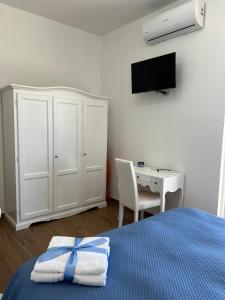 Postel nebo postele na pokoji v ubytování Dente di Leone