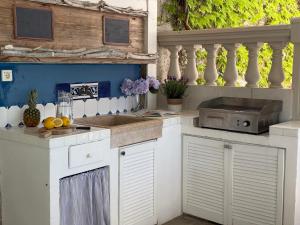 Kuchyň nebo kuchyňský kout v ubytování Pavi apartments Vila Amalia