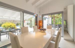 a dining room with a large table and chairs at Ca'n Fanals in Alcudia