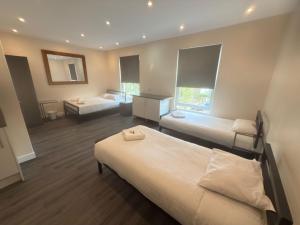 Postel nebo postele na pokoji v ubytování Saba Hotel London