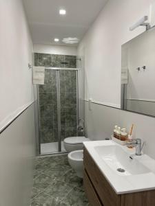 a bathroom with a toilet and a sink and a shower at Ninfa Roda B&B in Vietri sul Mare +27 photos
