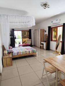 Postel nebo postele na pokoji v ubytování Villa Manamé, face à l'océan