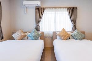Katil atau katil-katil dalam bilik di A3 Maximum 8 people OK! Perfect for families and groups! Free parking for up to 2 cars! Walking distance to the beach & many restaurants A3コーディアルステイ