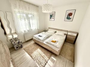 Posteľ alebo postele v izbe v ubytovaní Pine Apartment & Pool