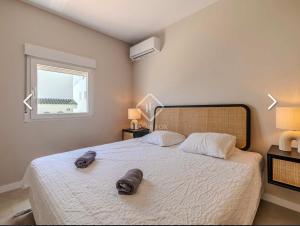 Ένα ή περισσότερα κρεβάτια σε δωμάτιο στο Sea View Apartment Cala Blanca Xabia