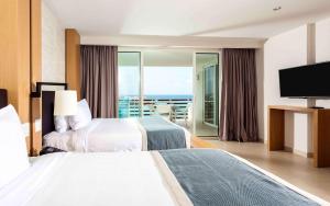 Sonesta Ocean Point Resort- All Inclusive - Adults Only客房内的一张或多张床位