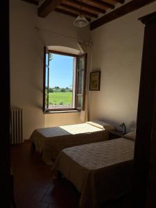 Postel nebo postele na pokoji v ubytování Rustico Sant'Emilio