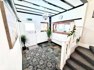 a hallway of a house with blue ceilings at 304 Norbury House in Norbury